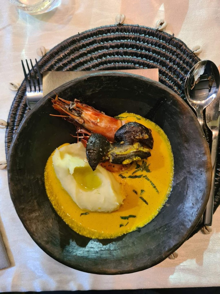 The main dish at the Awari experience: egusi with sweet potato puree, prawns and snail