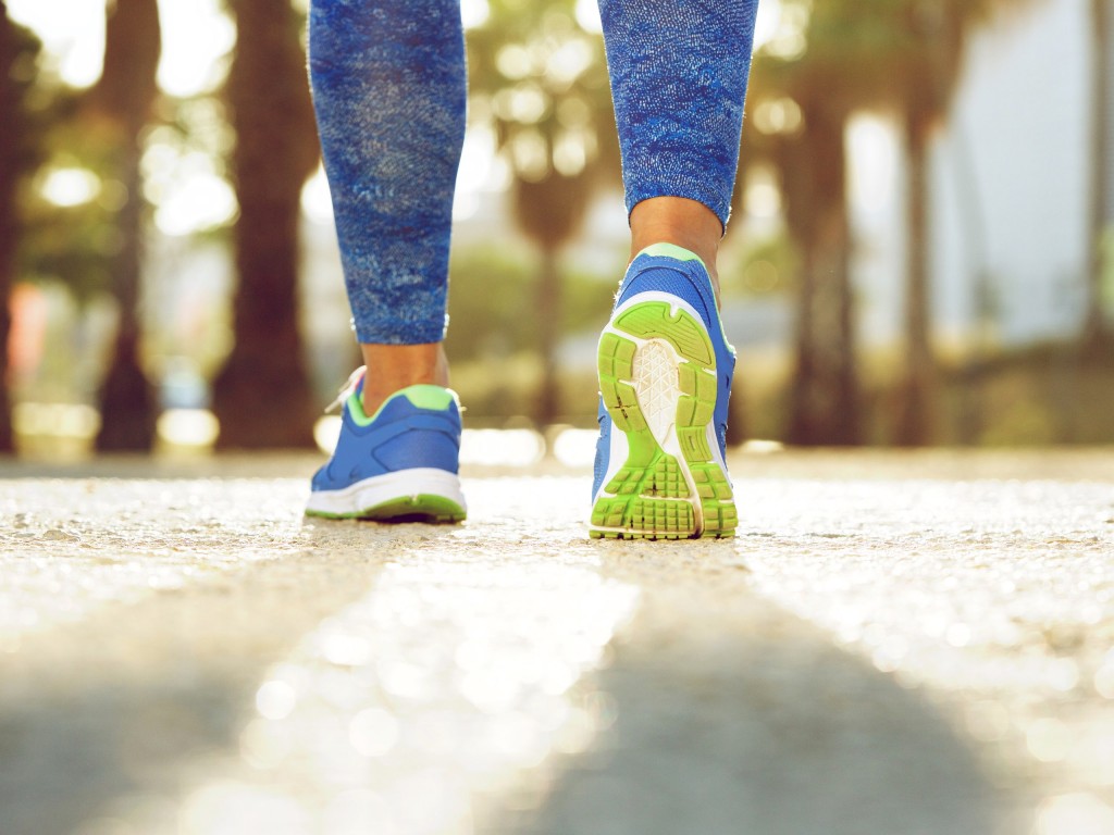 Close up image of a Black person taking a walk