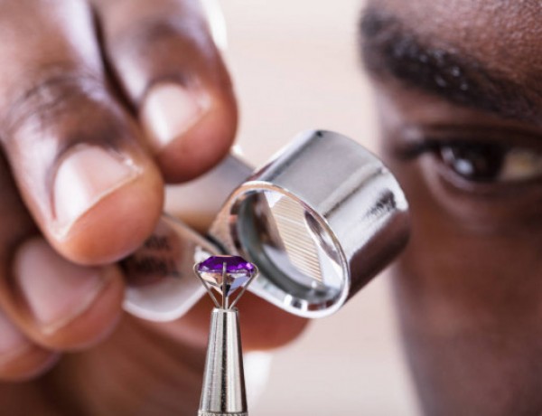 jeweler-examining-diamond-loupe