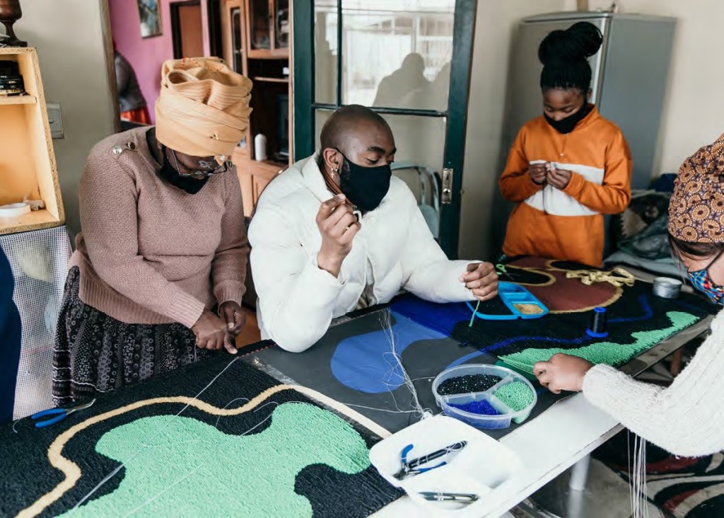 Rick Mnisi working with artisans from Coral and Hive